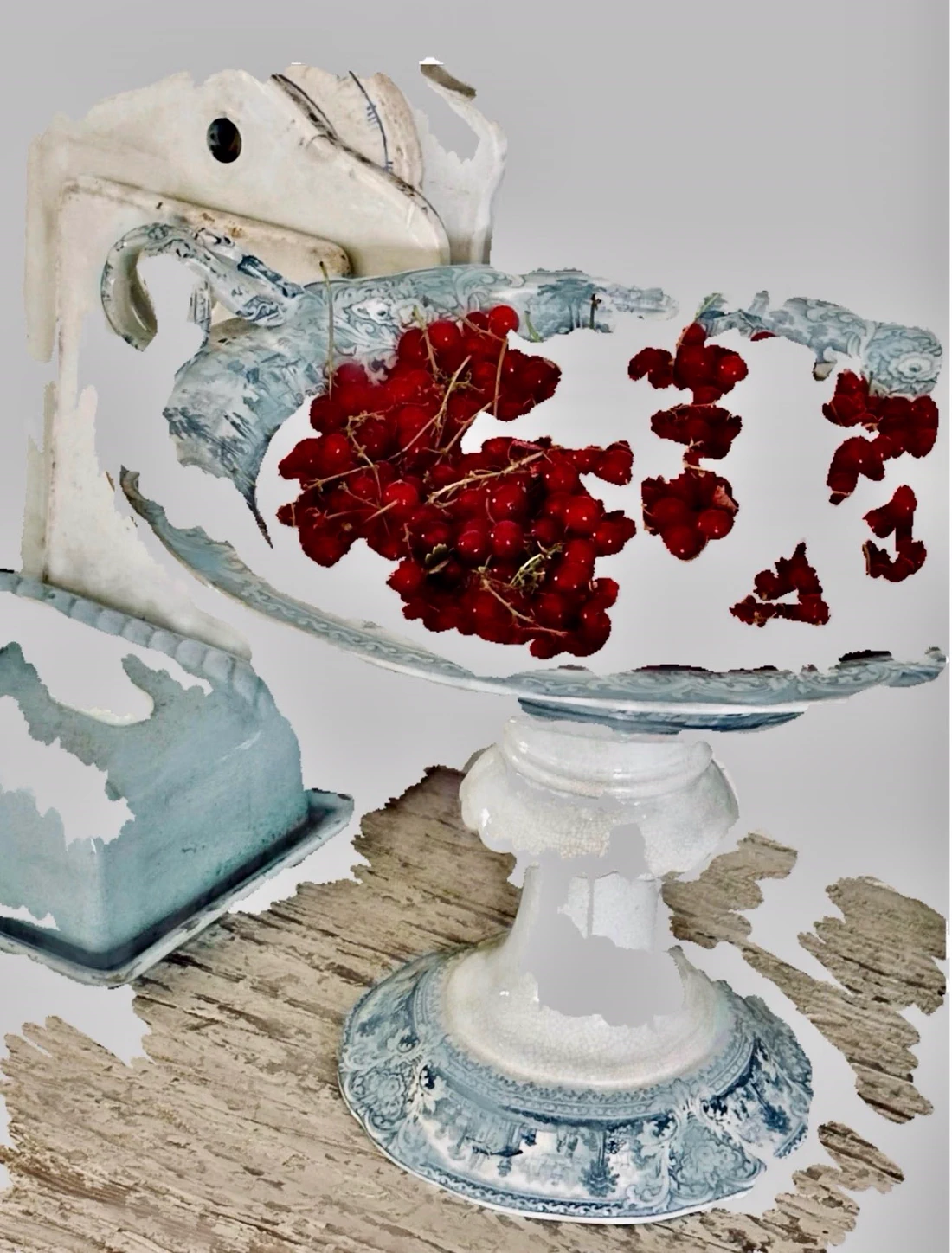 Vivid red berries suspended above a worn, incomplete surface in muted greens and greys.