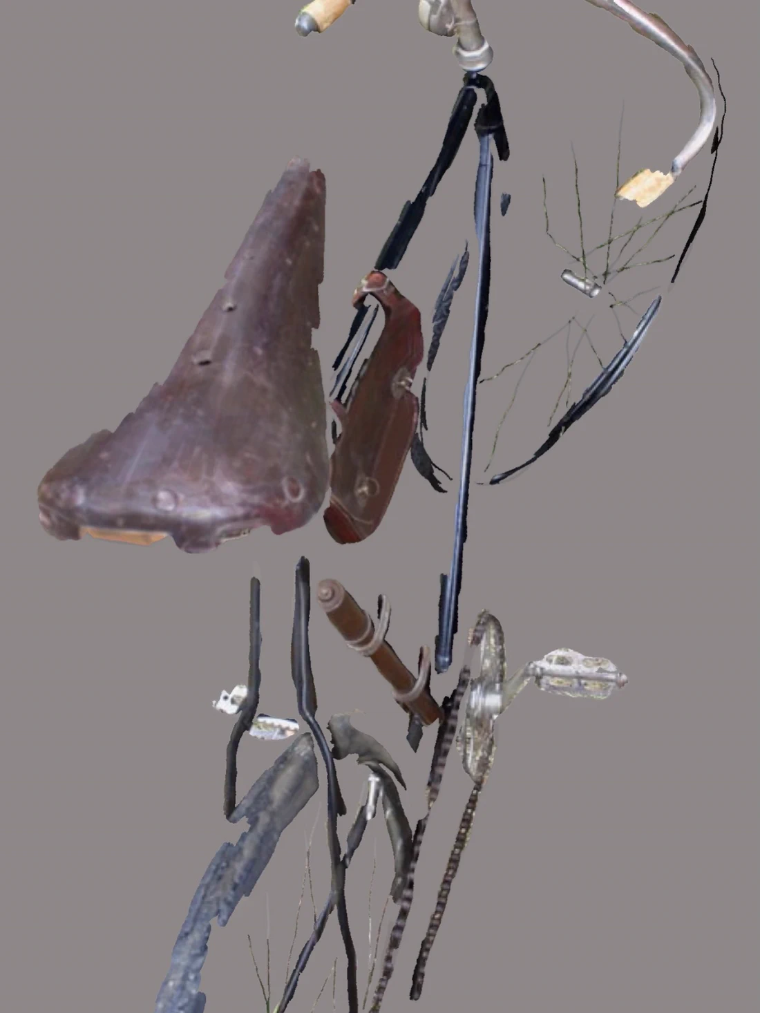 Parts of a bicycle, a wheel and sections of frame, detached and hovering in uncertain space on a pale ground.